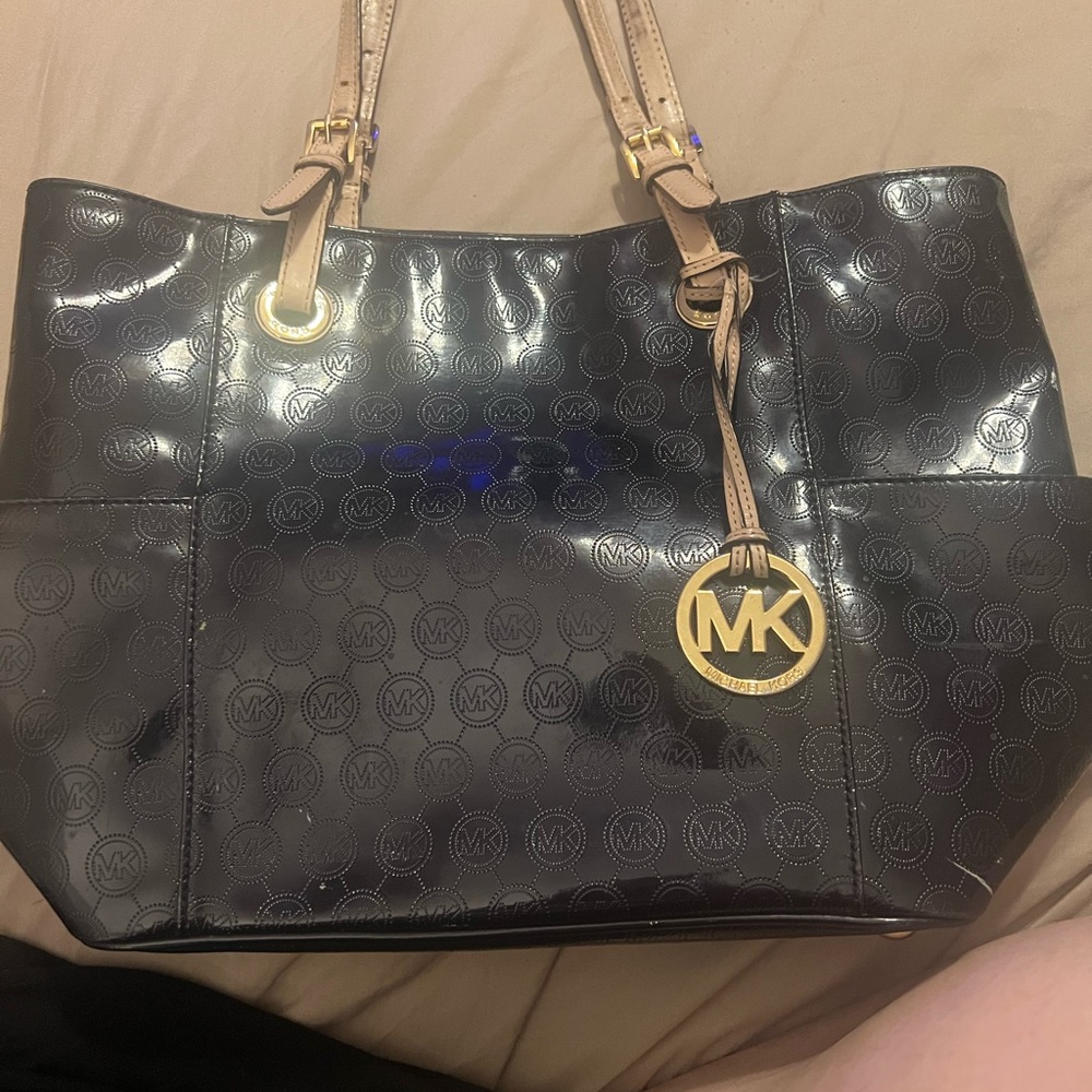 Michael Kors Black and Gold Tote Bag with Chain Straps and Spacious Design